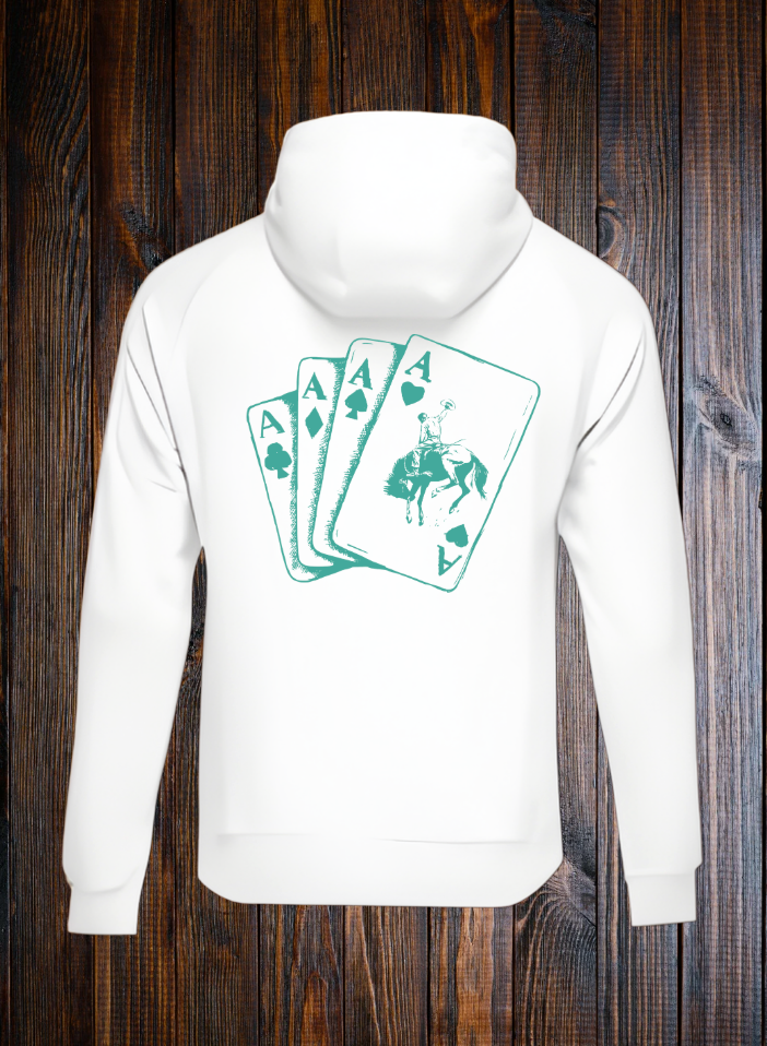 White hoodie with turquoise playing cards with a bucking bronc design on a wooden background