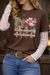 Woman wearing a brown t-shirt with a cow graphic, white lace sleeves, and blue jeans.