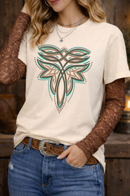 Person wearing a white t-shirt with a decorative design, brown long-sleeve underneath, blue jeans, and a belt.
